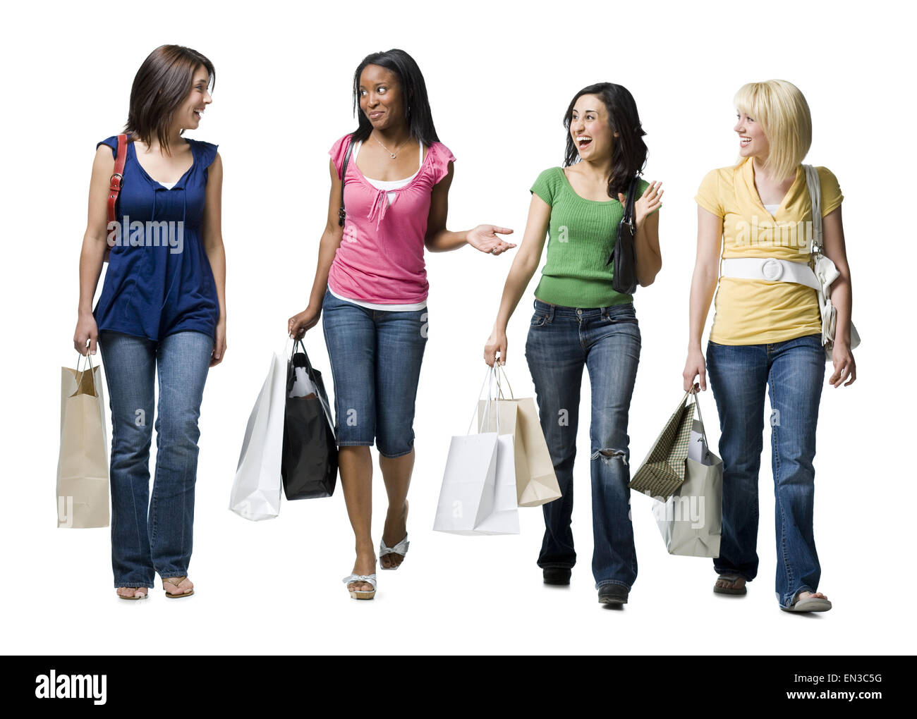 Quatre femmes shopping smiling Banque D'Images