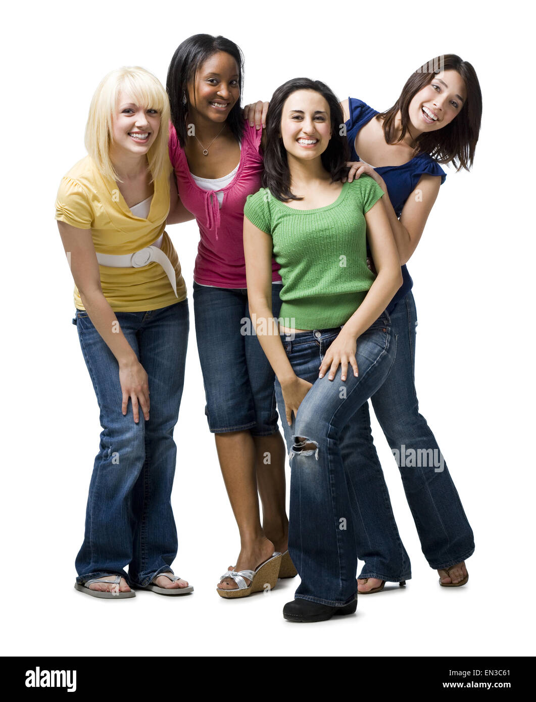 Quatre femmes hugging and smiling Banque D'Images