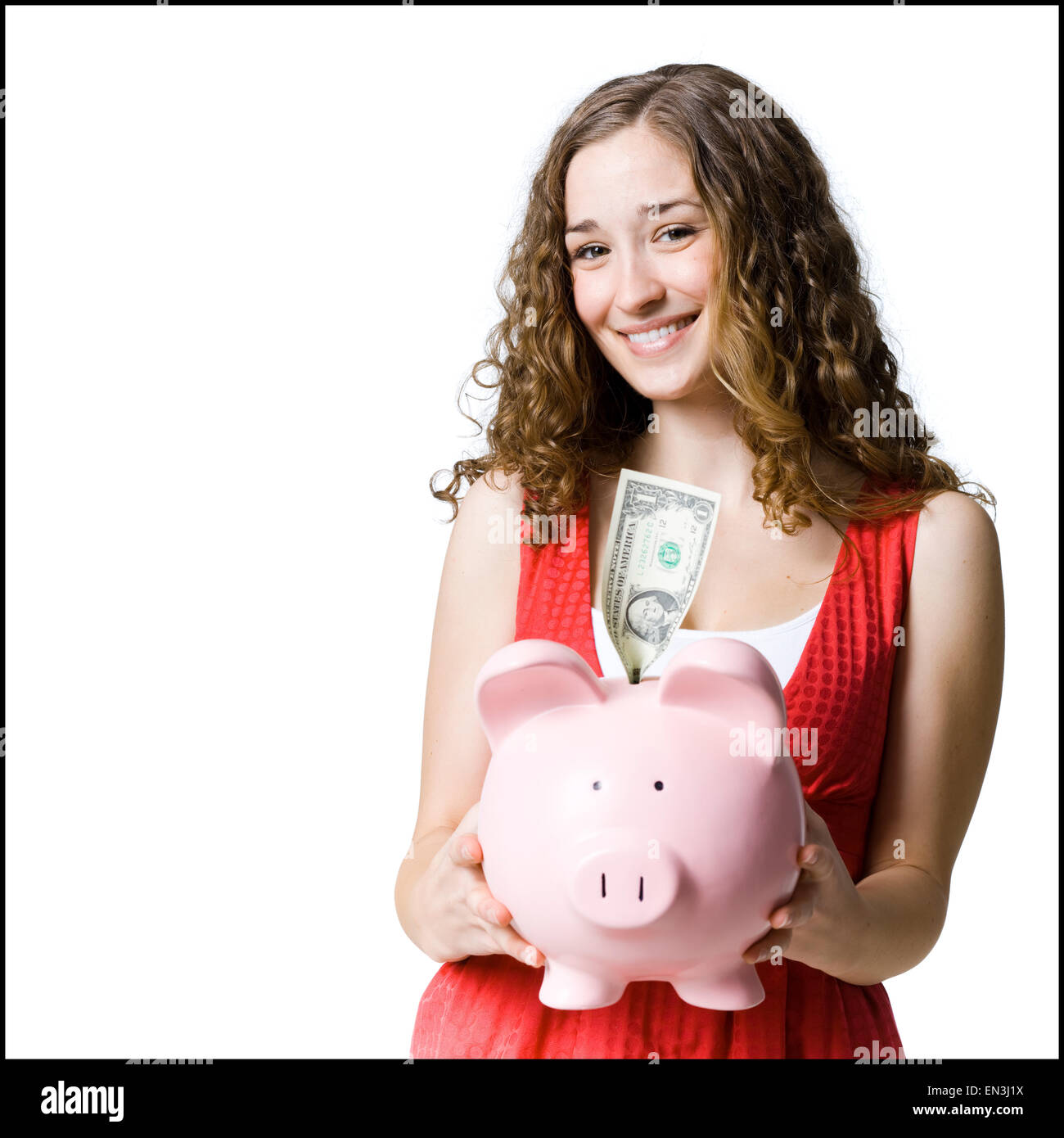 Woman holding a piggy bank Banque D'Images