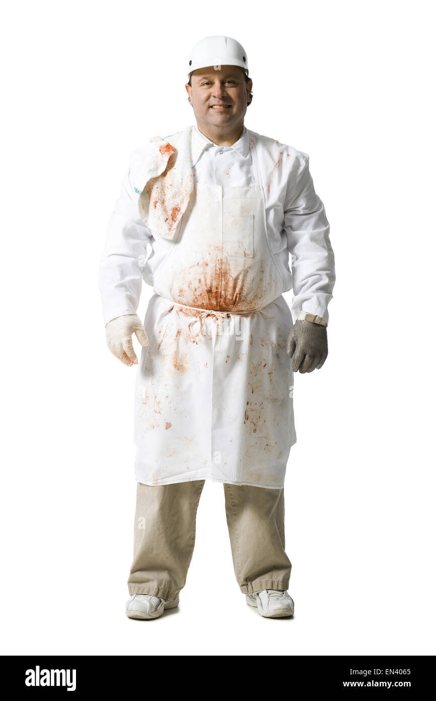 Butcher standing with arms crossed smiling Banque D'Images