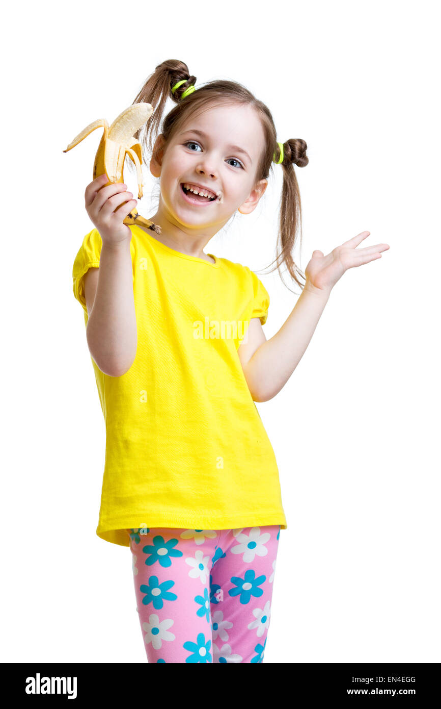 Cute little girl eating banana Banque D'Images
