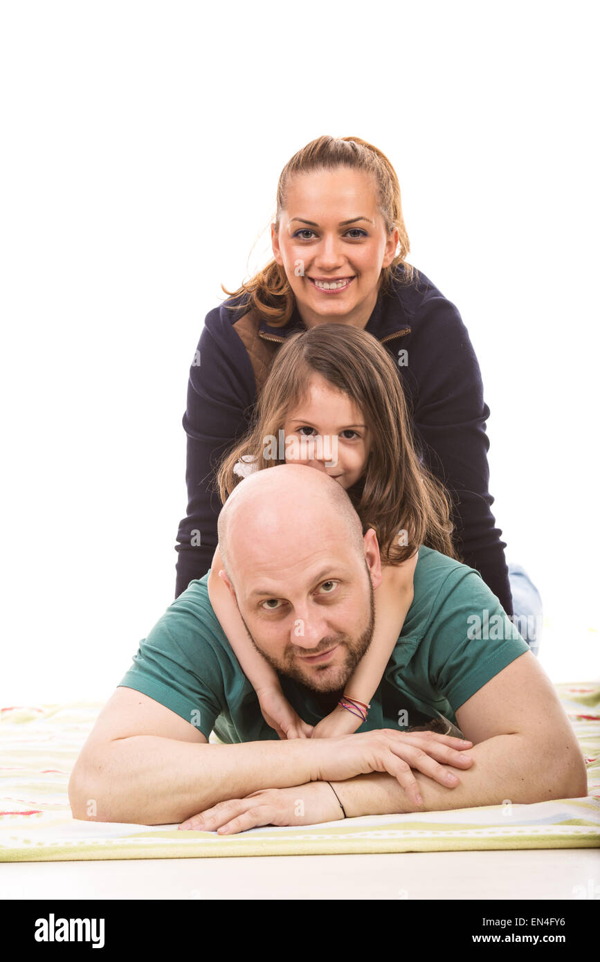 Famille heureuse sur le dessus les uns les autres contre fond blanc Banque D'Images