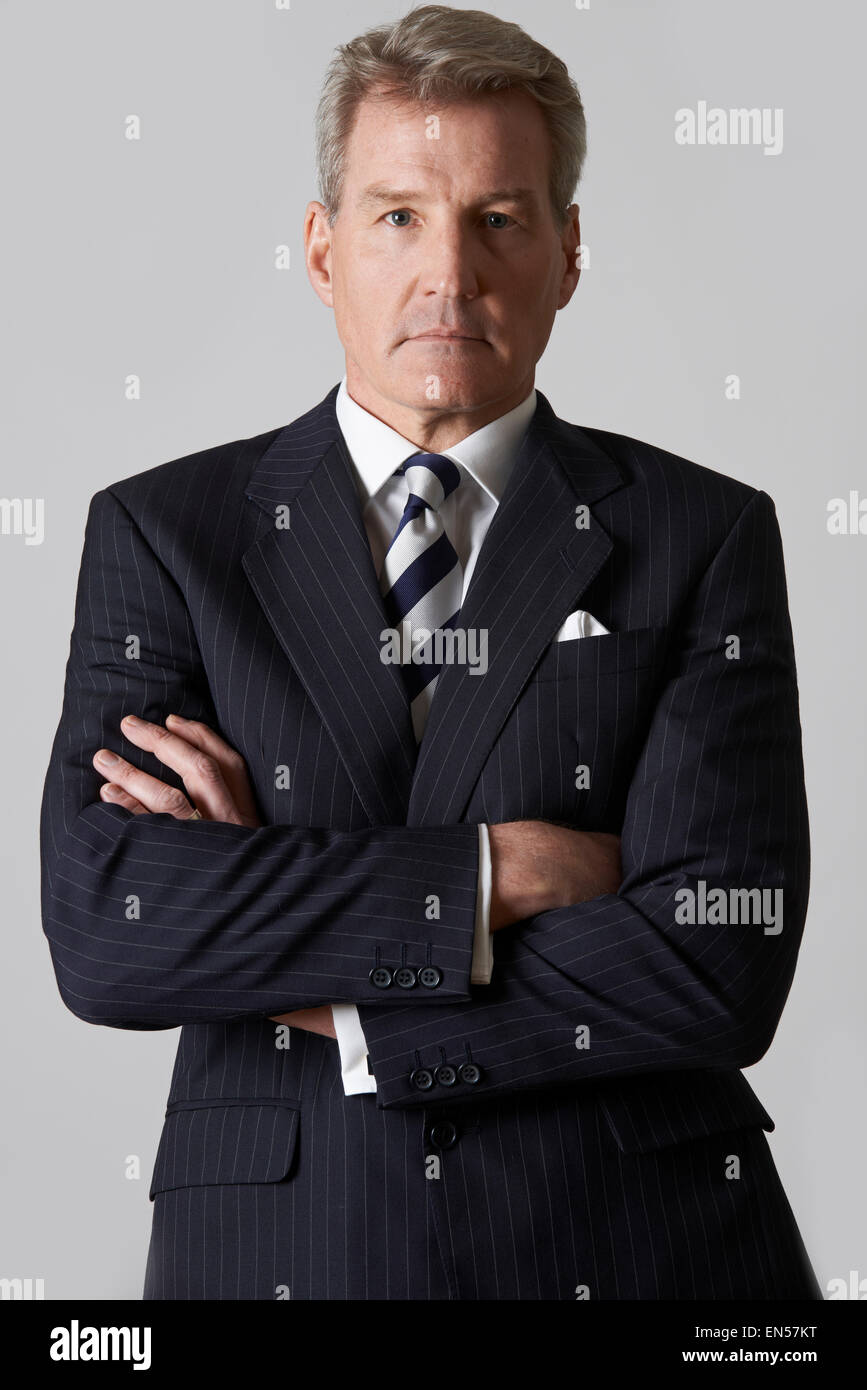 Portrait Of Mature Businessman With Crossed Arms Banque D'Images