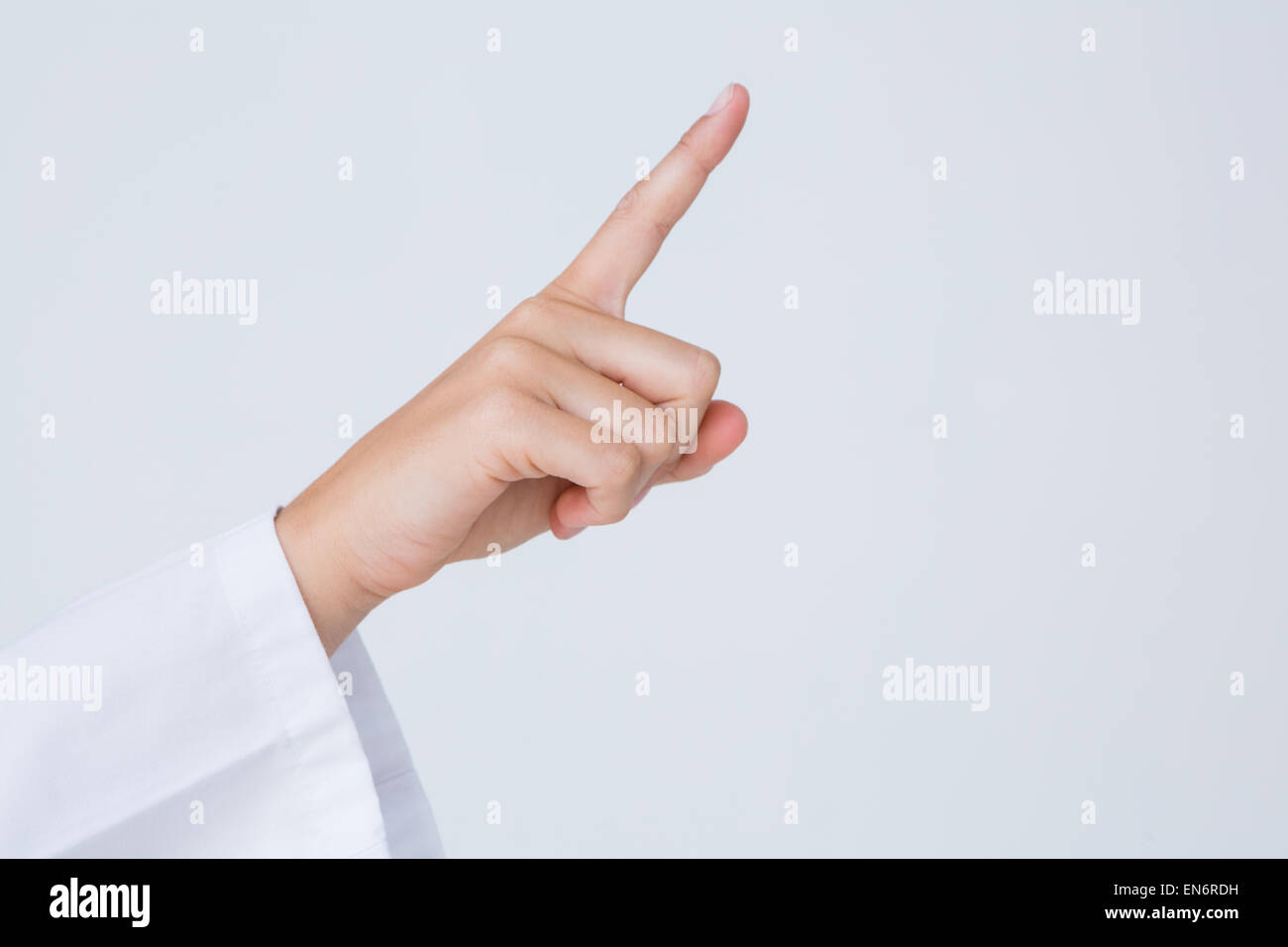 Docteur en pointant le doigt en l'air Banque D'Images