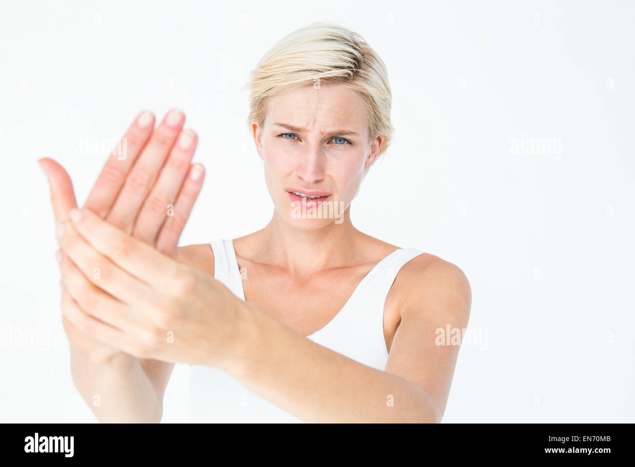 Jolie femme souffrant de douleur à la main Banque D'Images
