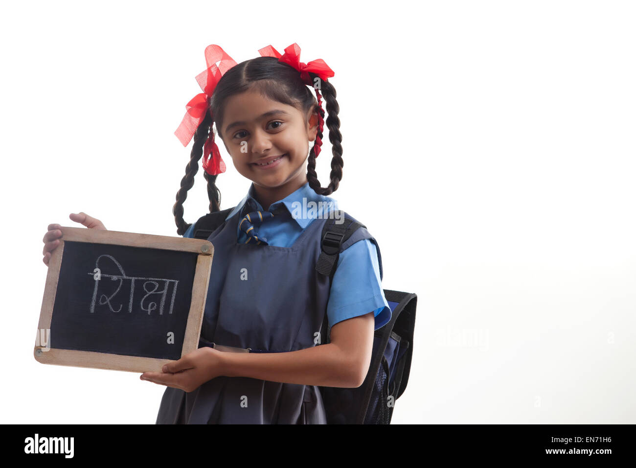 Portrait of school girl holding slate Banque D'Images