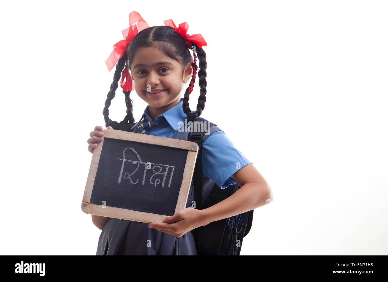 Portrait of school girl holding slate Banque D'Images