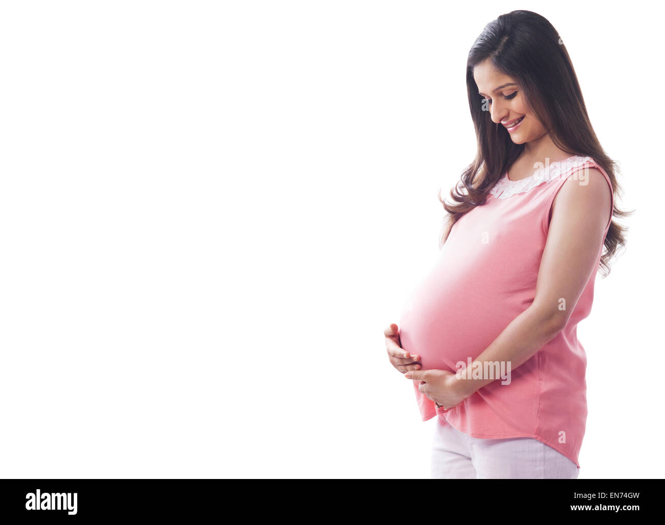 Pregnant woman holding sa Banque D'Images