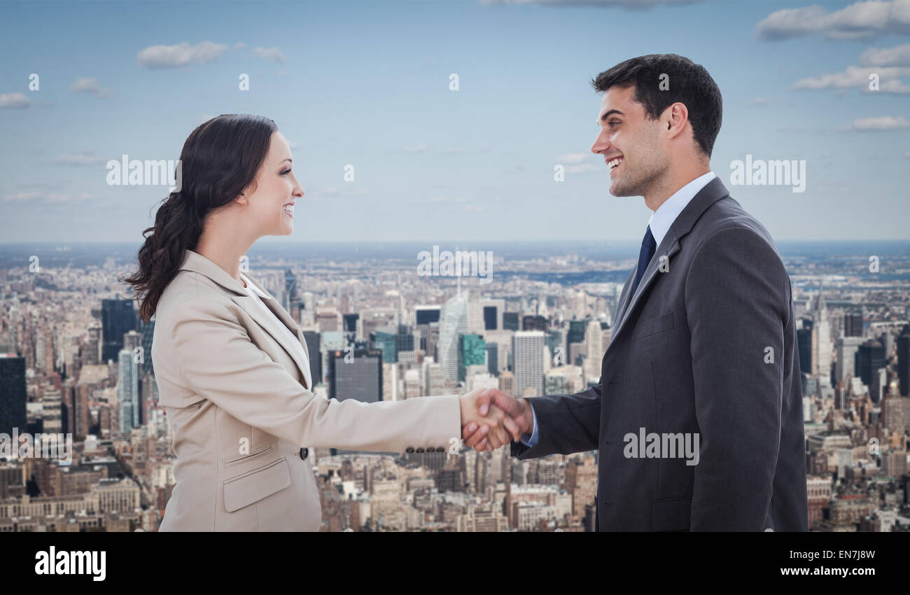 Image composite de futurs partenaires shaking hands Banque D'Images