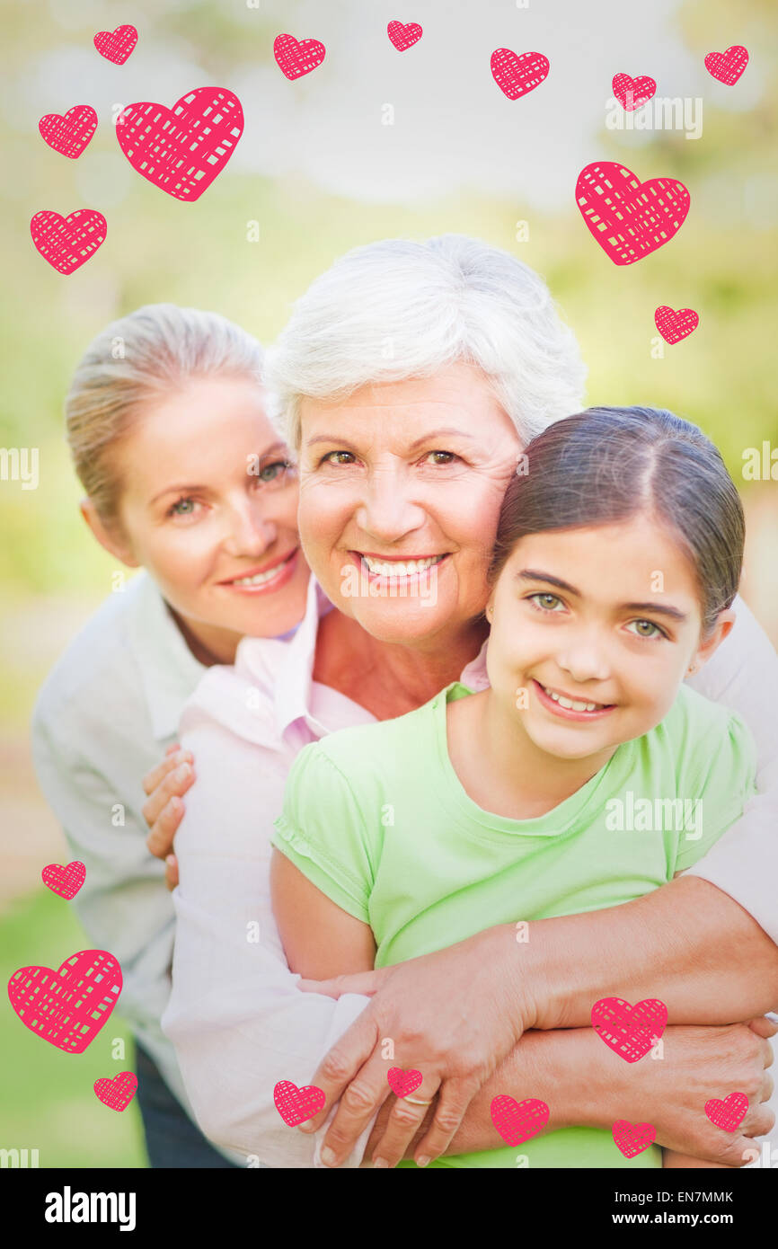 Image composite de l'adorable famille dans le parc Banque D'Images