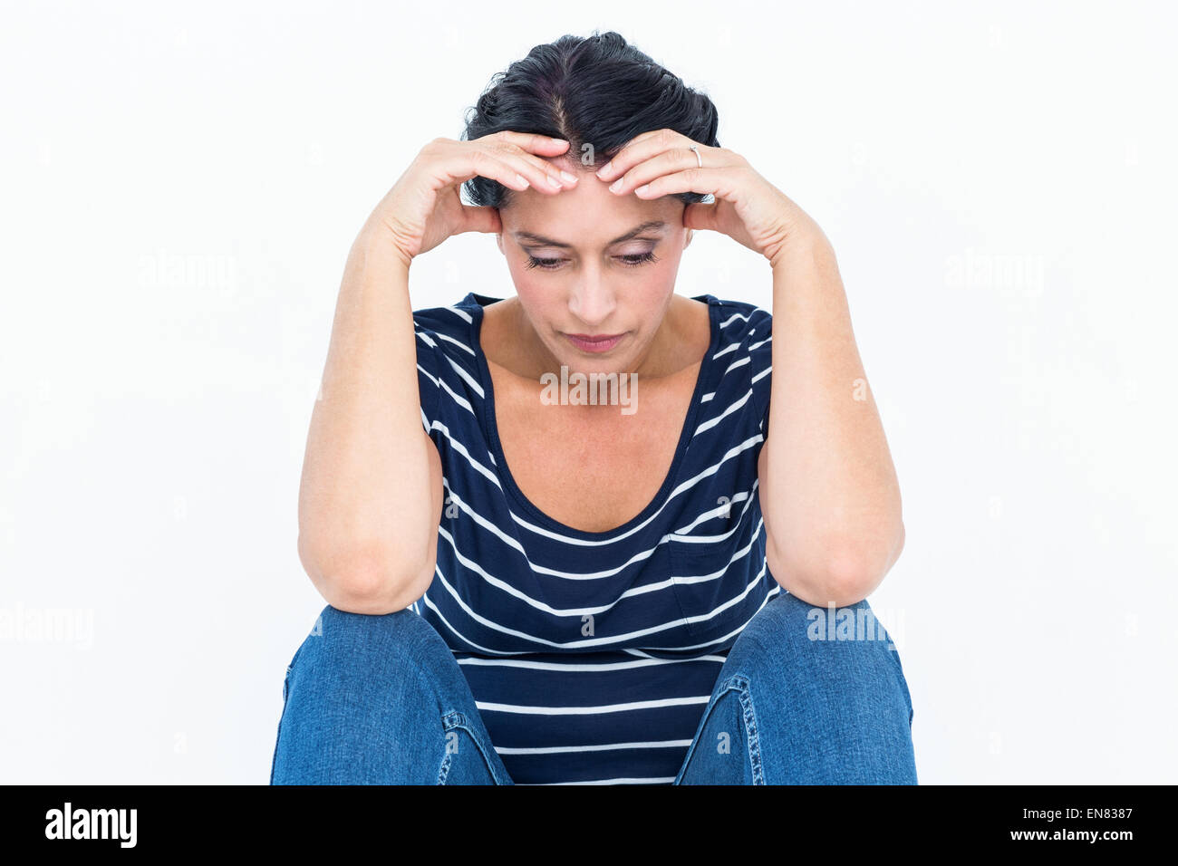 Sad woman with head in hands Banque D'Images