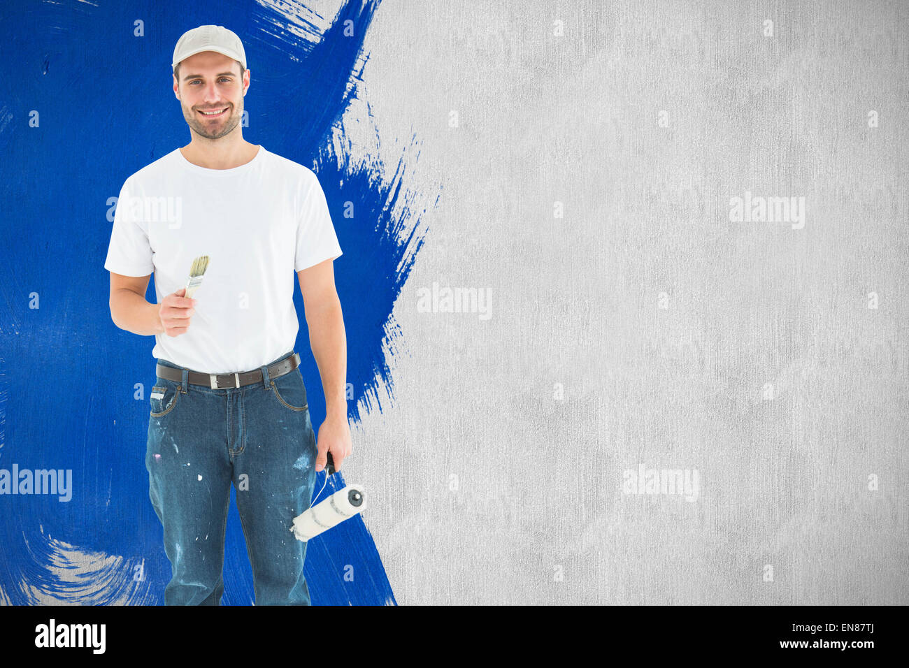 Composite image of man holding paint roller et pinceau Banque D'Images