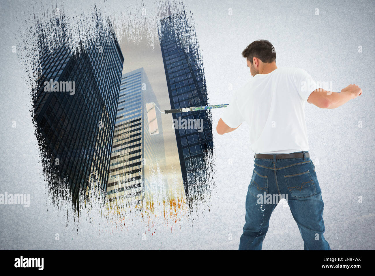 Image de l'homme composite à l'aide de rouleau à peindre sur fond blanc Banque D'Images