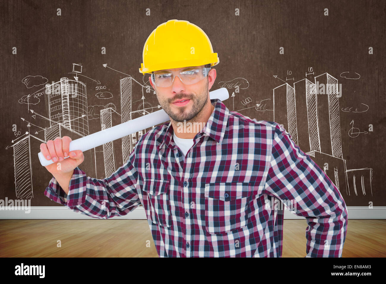 Image composite de handyman holding rolled up plan Banque D'Images