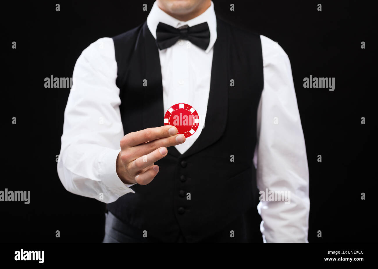 Dealer holding red casino gratuit Banque D'Images