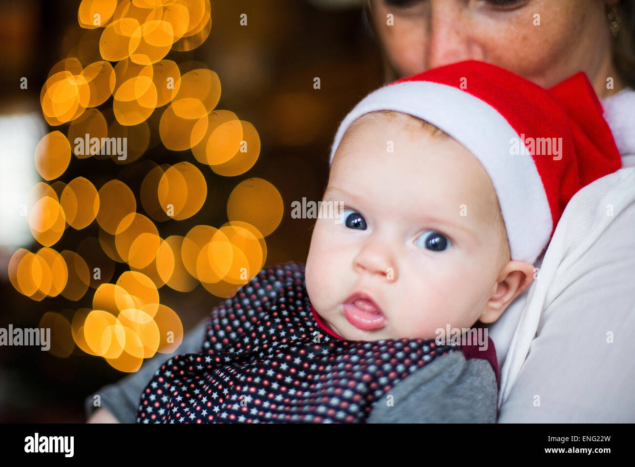 Close up of Caucasian baby girl wearing Santa hat Banque D'Images