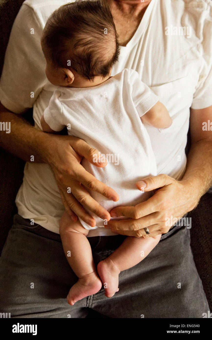 High angle view of father holding baby boy Banque D'Images