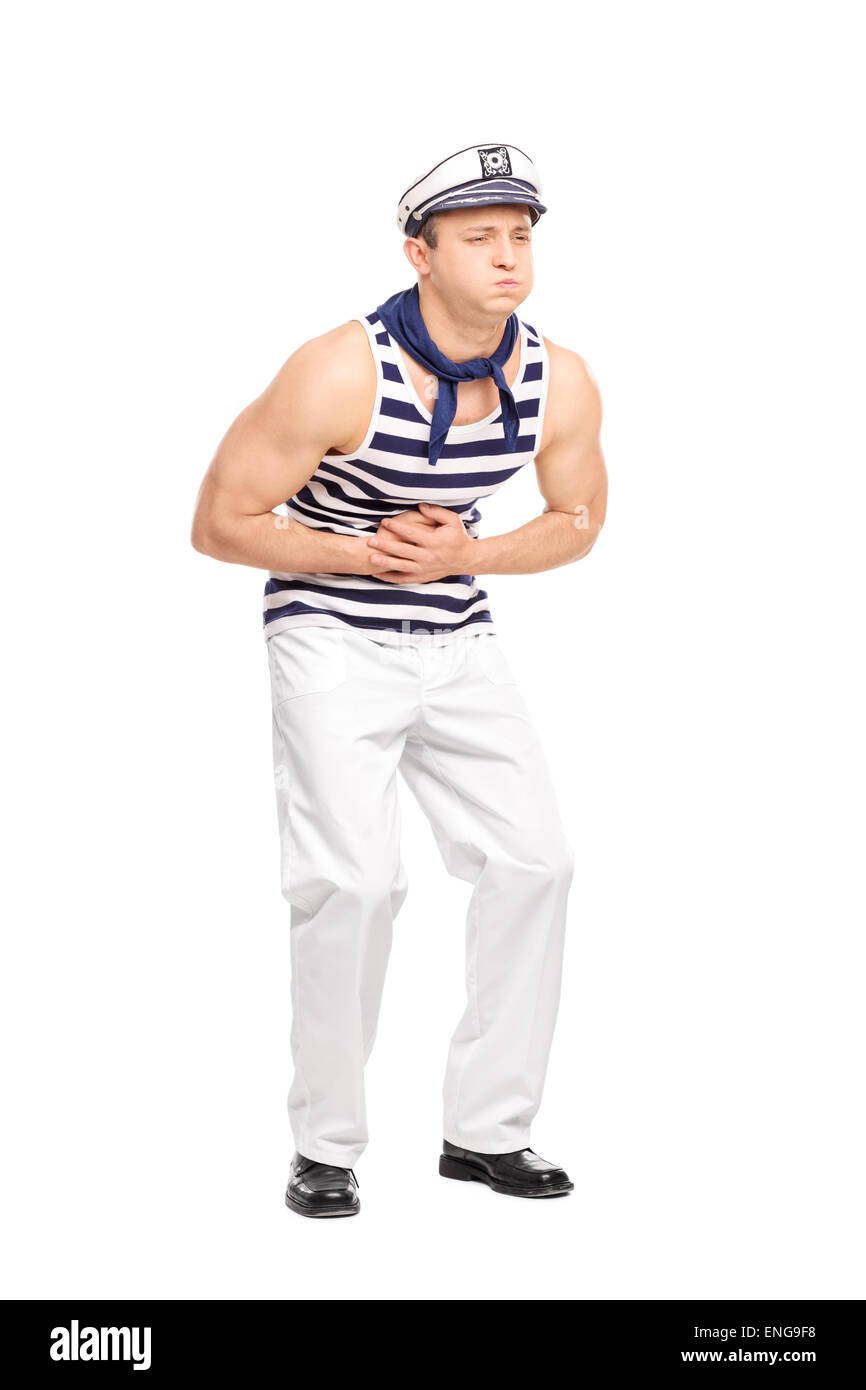 Portrait d'un jeune marin mâle sentiment d'estomac isolé sur fond blanc Banque D'Images