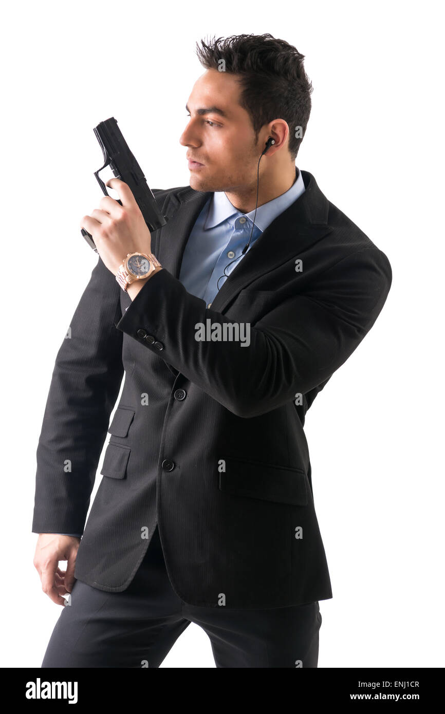 Homme élégant avec arme à feu, habillé comme un espion ou agent secret  Photo Stock - Alamy