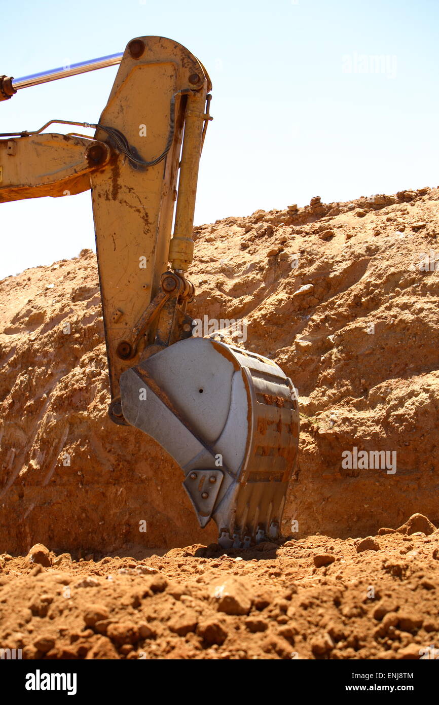 Vue rapprochée d'une pelle excavatrice d'un sur un site de construction Banque D'Images