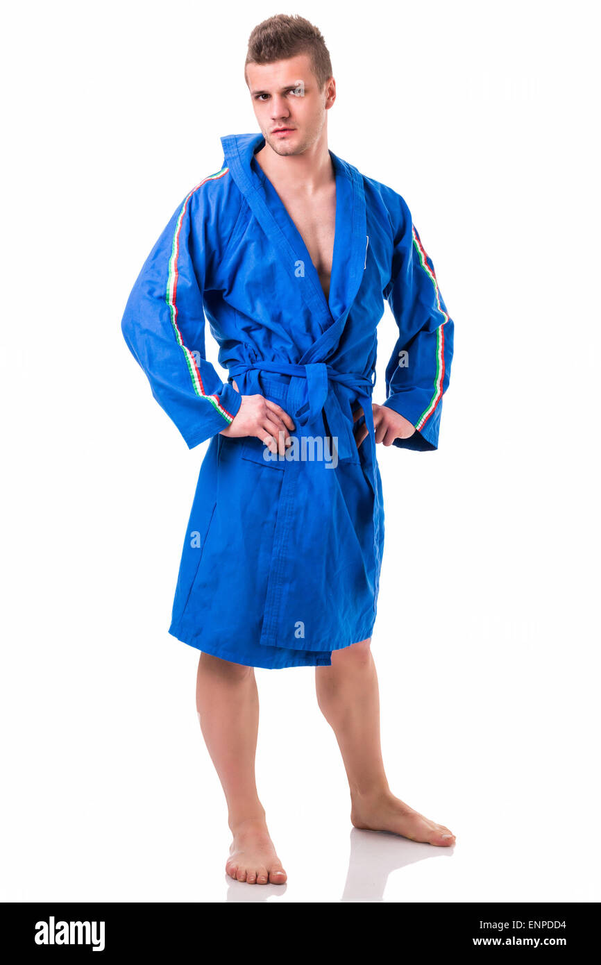 Beau jeune homme portant un peignoir bleu, isolé sur fond blanc Photo Stock  - Alamy