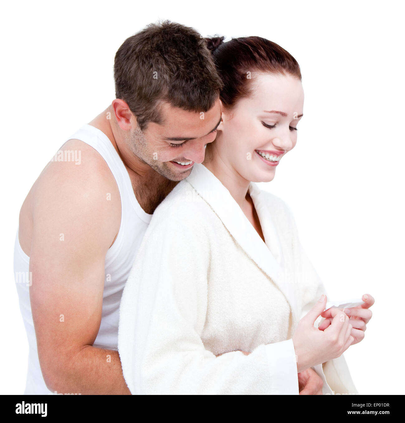 Adorable couple smiling together against a white background Banque D'Images