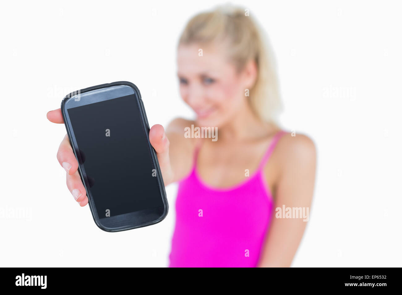 Portrait de jeune femme qui vous montre son nouveau smartphone Banque D'Images