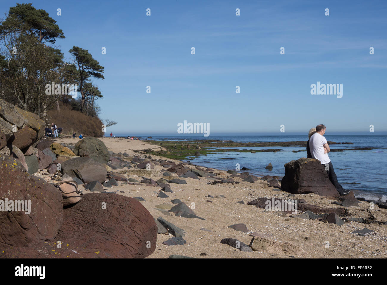 Couple au bord de mer à Sunshine Banque D'Images