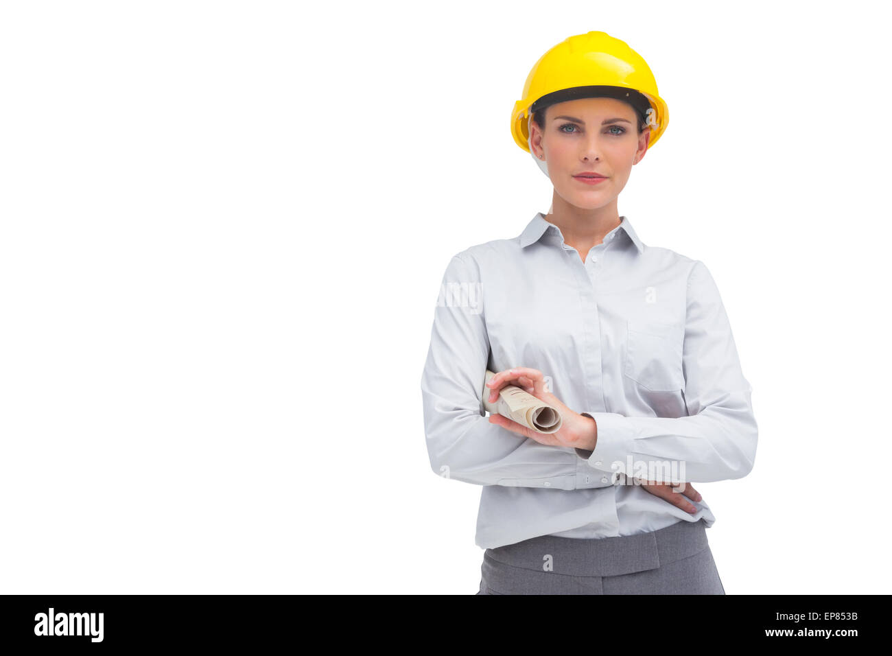 Femme architecte avec casque jaune et plan enroulé Banque D'Images