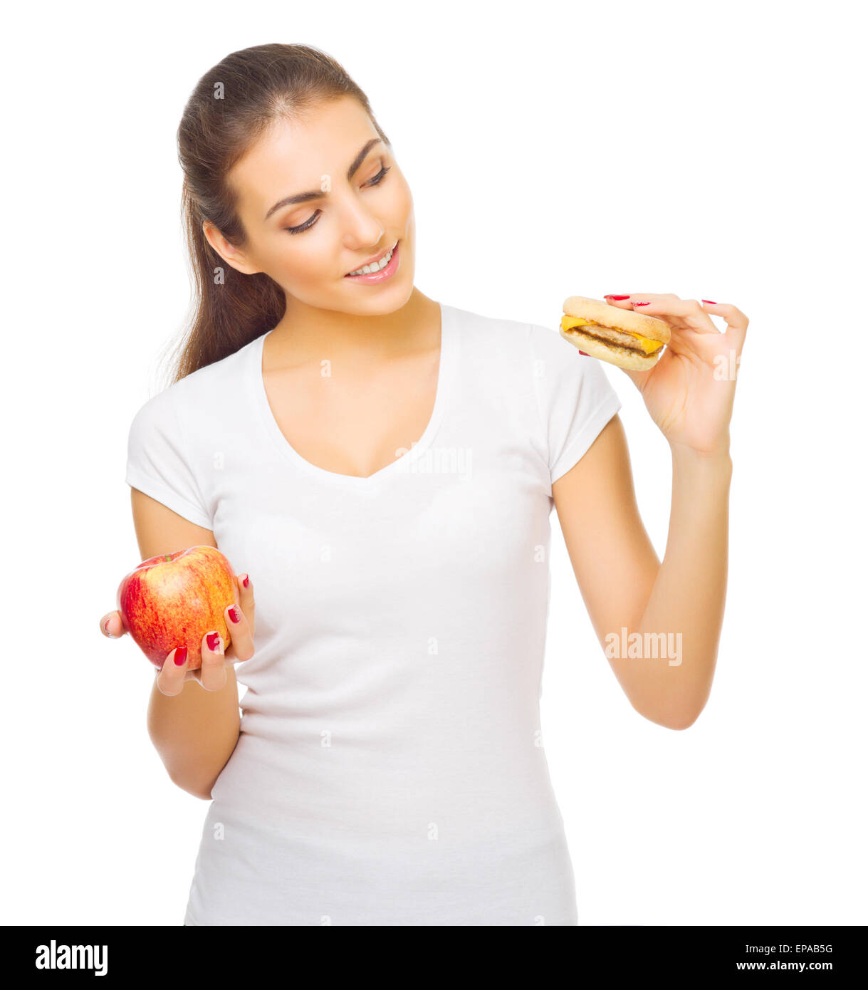 Jeune fille avec hamburger et isolés d'apple Banque D'Images