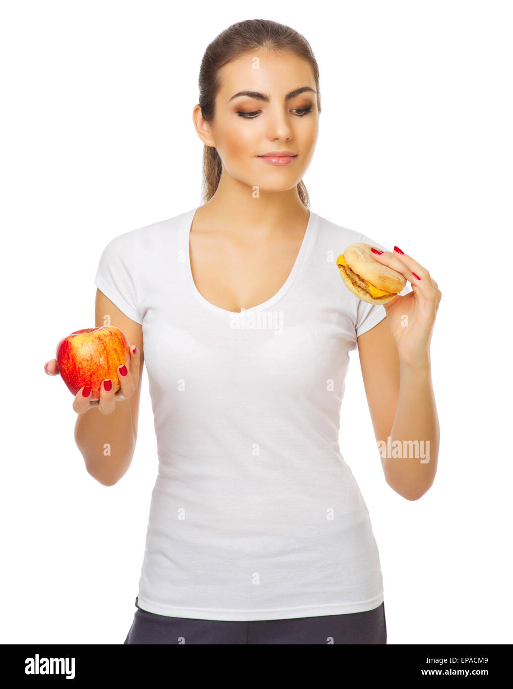 Jeune fille avec apple et isolées du hamburger Banque D'Images
