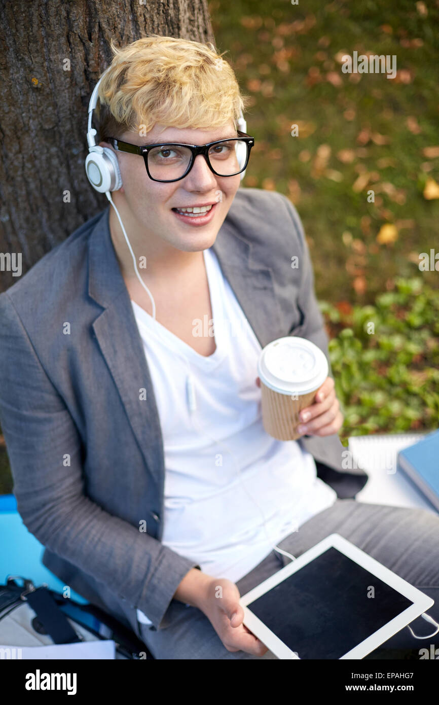 Happy girl in Headphones with tablet pc Banque D'Images