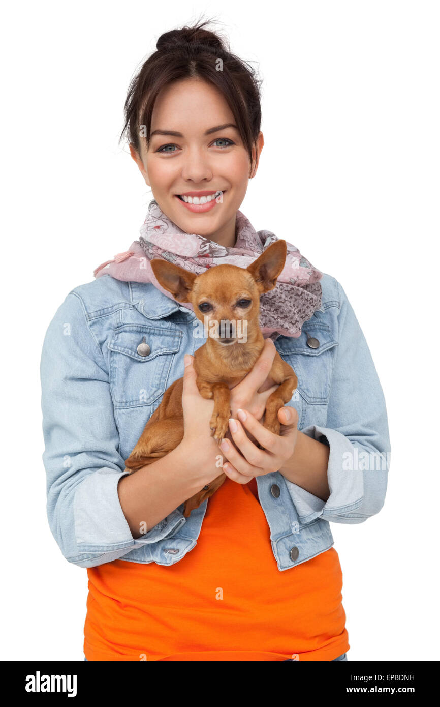 Portrait of a smiling young woman with pet dog Banque D'Images