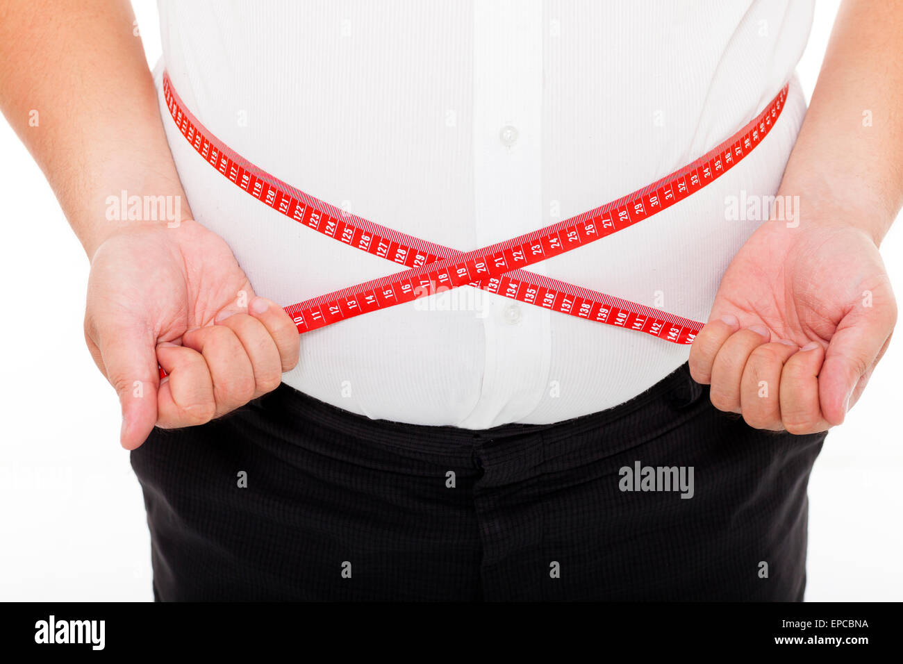 Gros homme tenant un ruban de mesure Banque D'Images