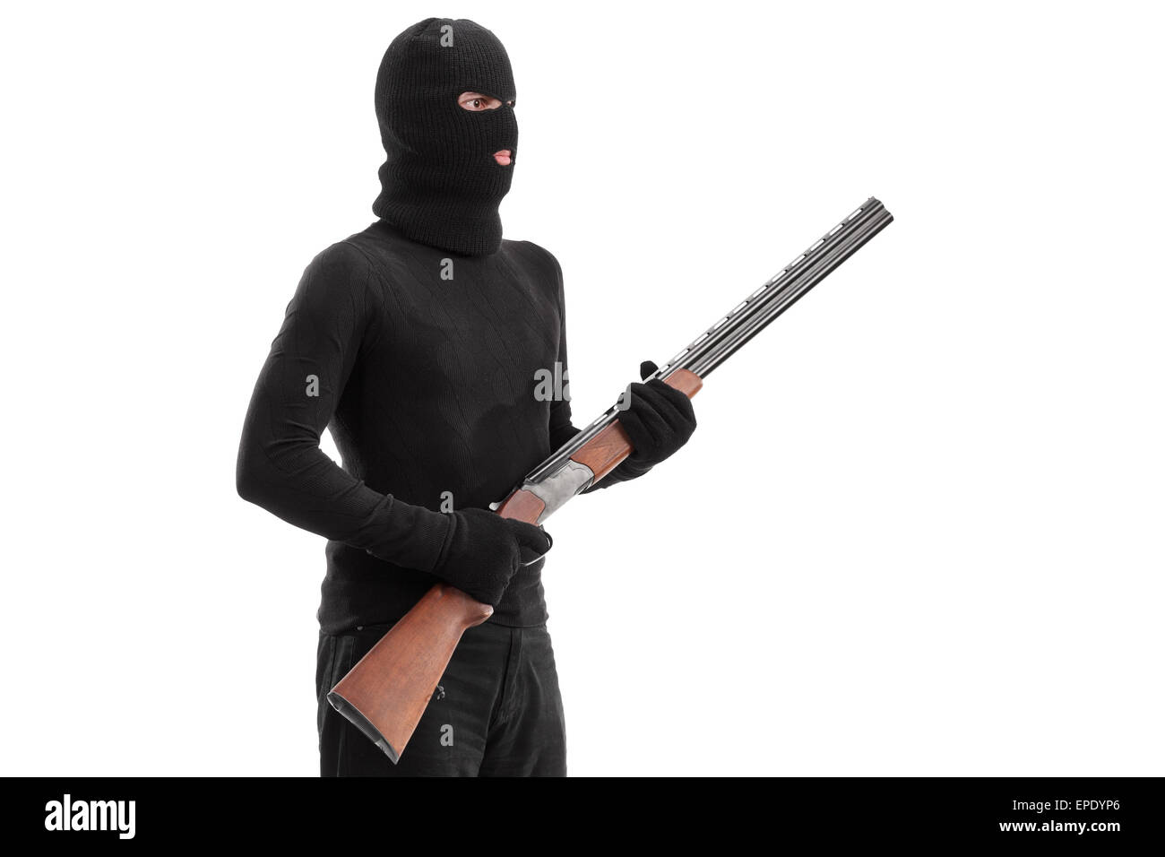 Dangereux criminel tenant un fusil carabine isolated on white background, studio shot Banque D'Images