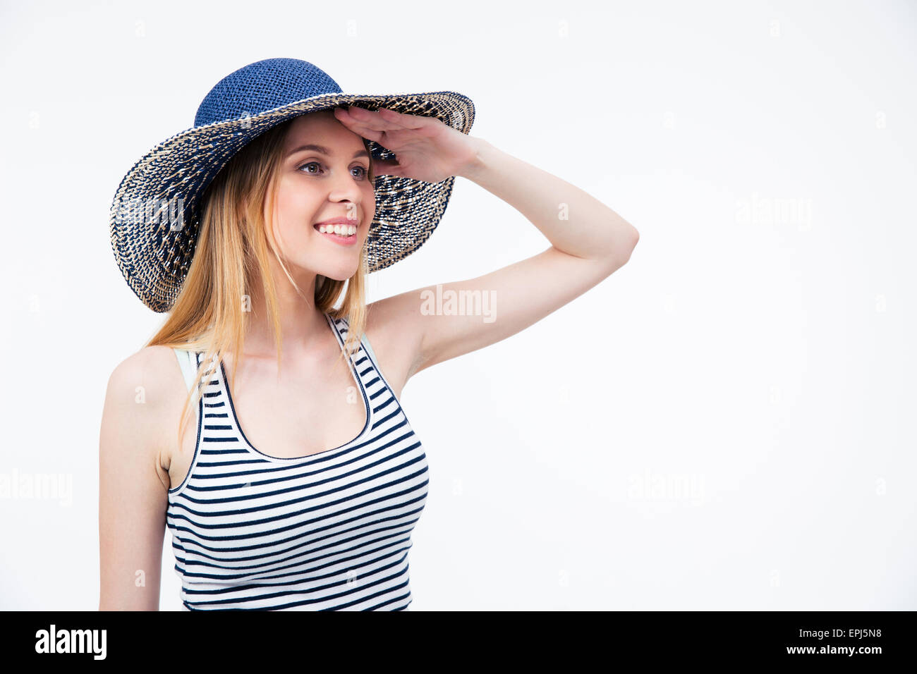 Happy cute woman in hat à distance en over white background Banque D'Images