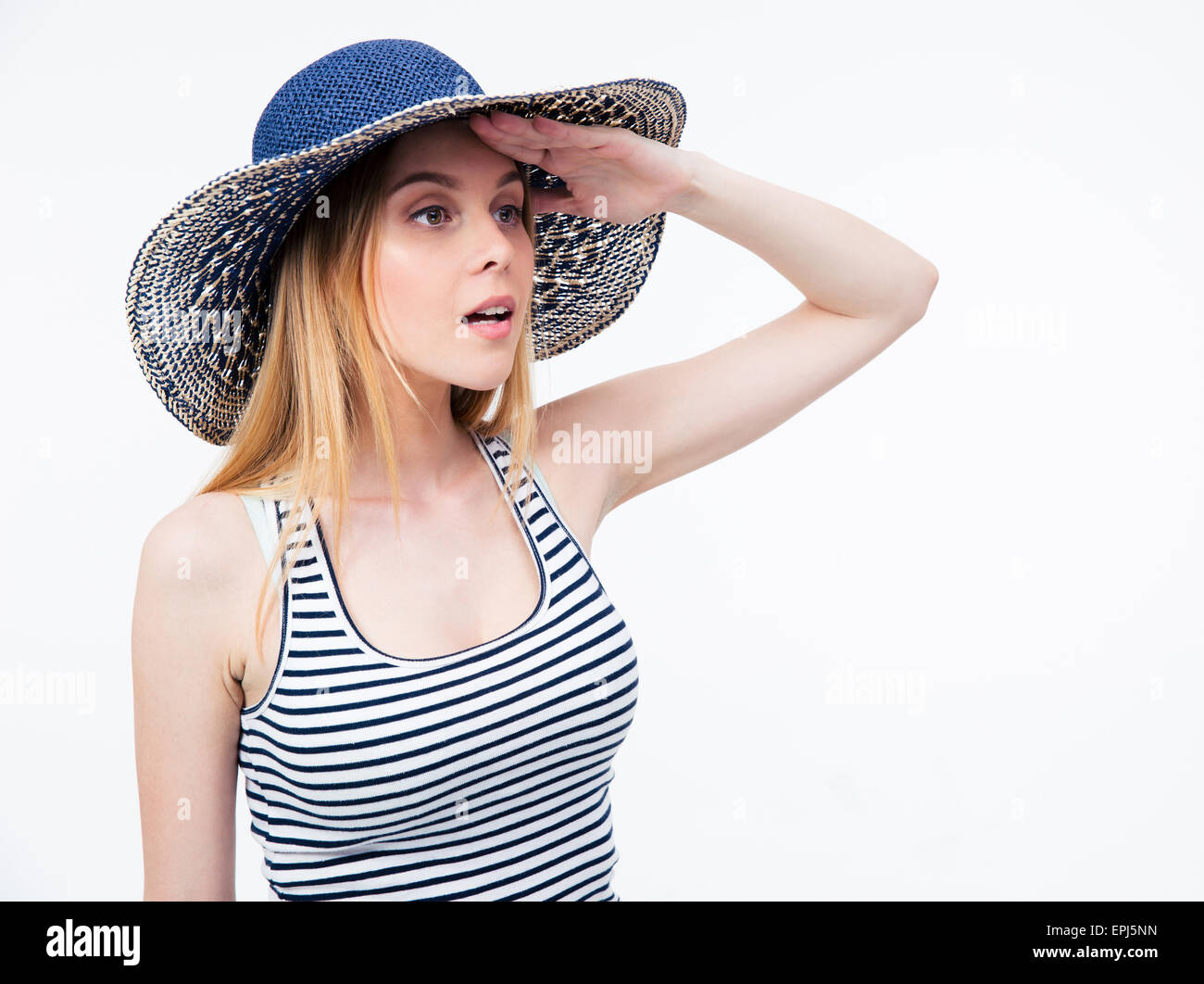 Young woman in hat à distance en over white background Banque D'Images