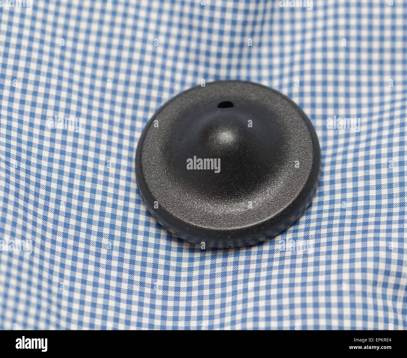 Vêtements de sécurité tag rond noir Banque D'Images