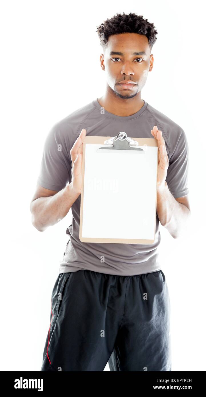 Belle afro-american man posing in a studio isolé sur un arrière-plan Banque D'Images