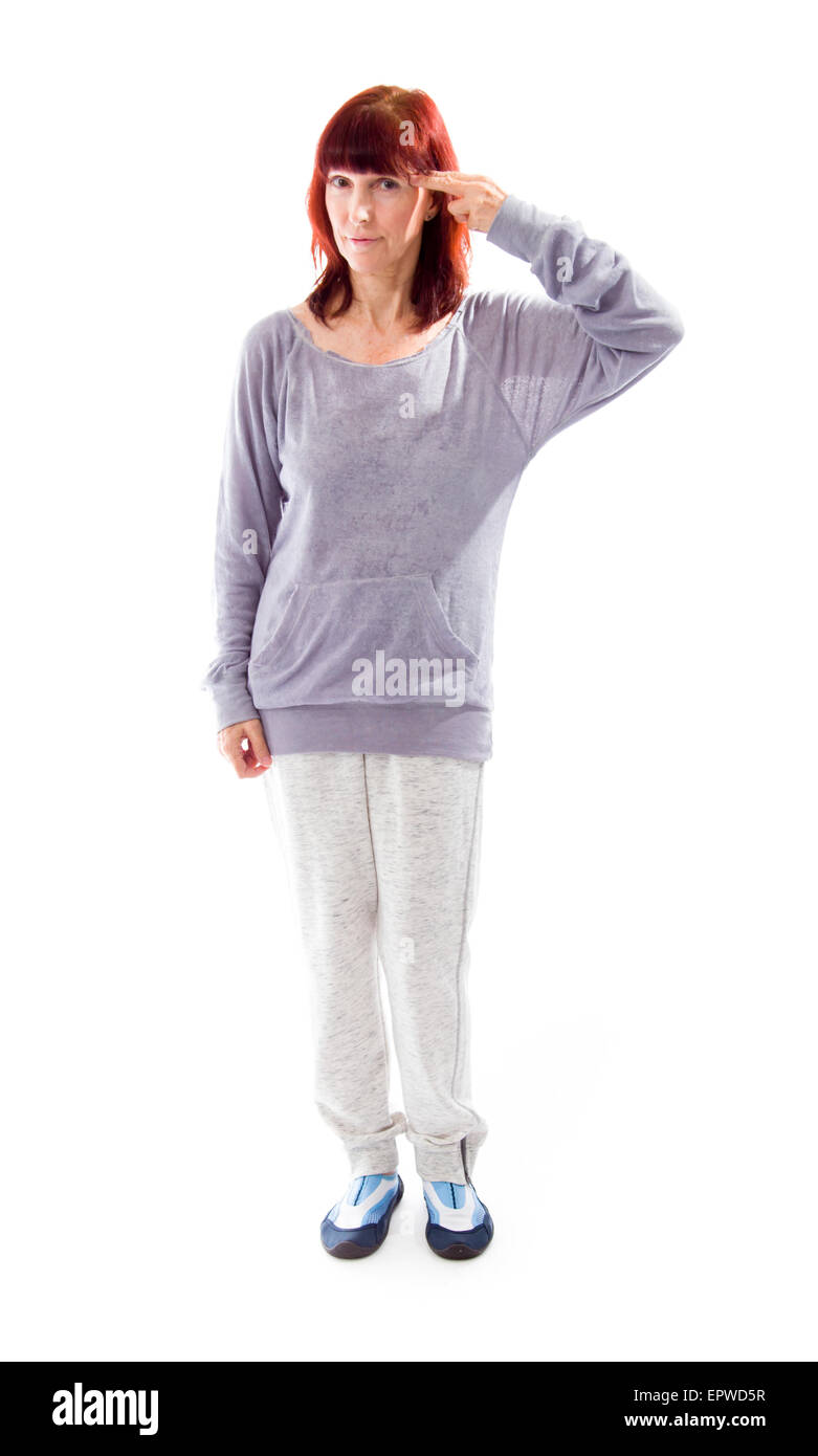 Mature Woman holding son doigt contre sa tête Banque D'Images