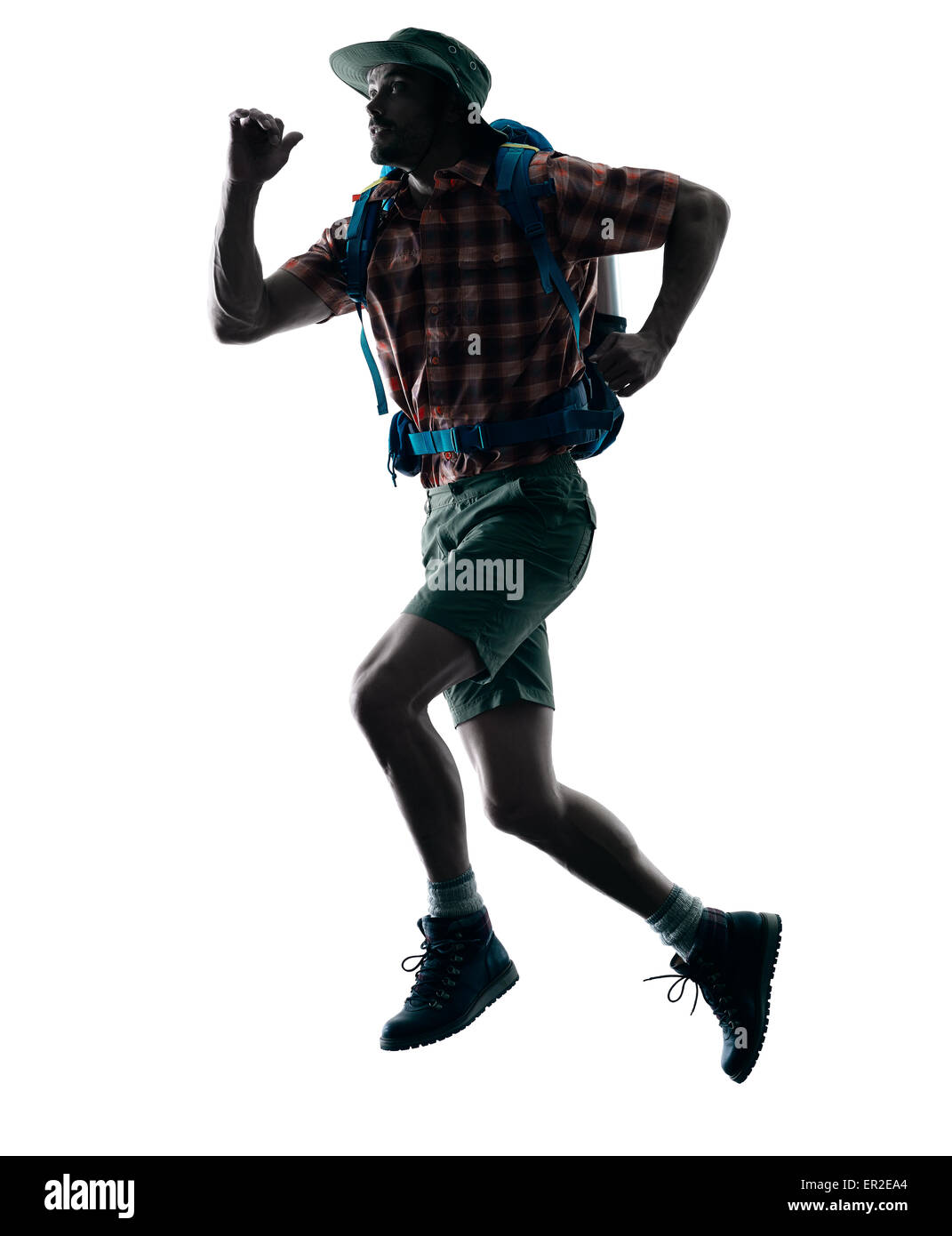 Un homme de race blanche trekker trekking running heureux en silhouette isolé sur fond blanc Banque D'Images