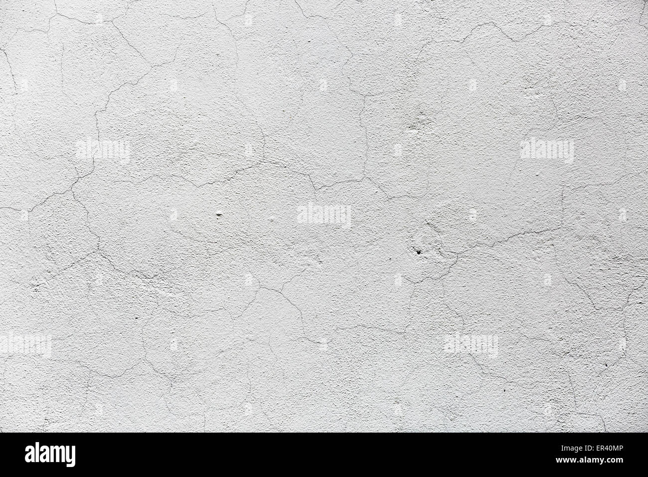 Abstract grunge background. Mur Blanc avec plâtre fissuré. Banque D'Images