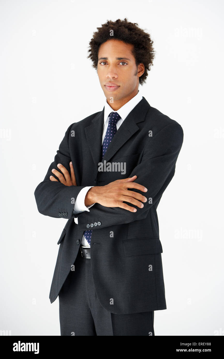 Studio Portrait Of businessman standing Against White Background Banque D'Images