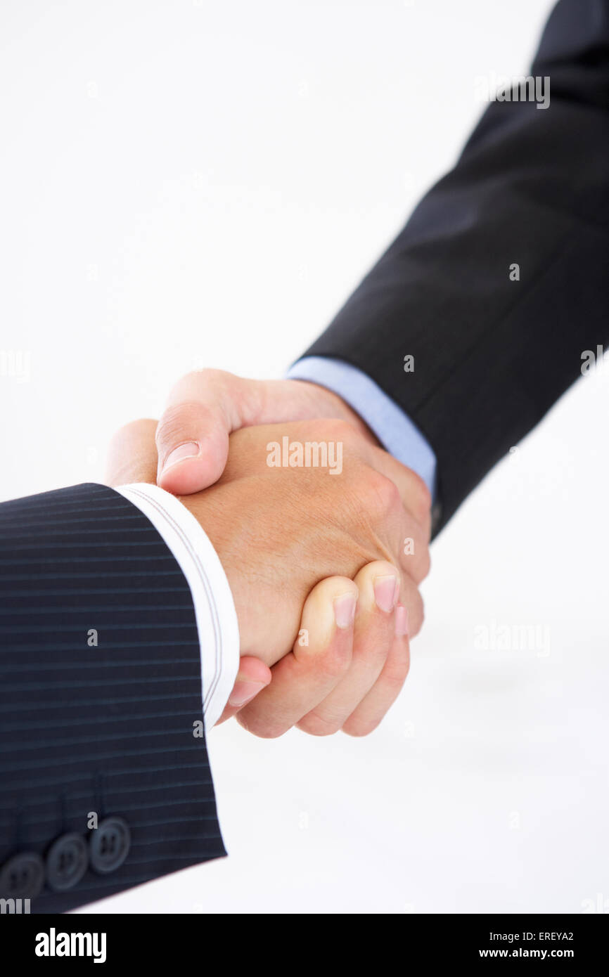 Close Up of Businessmen Shaking Hands Banque D'Images