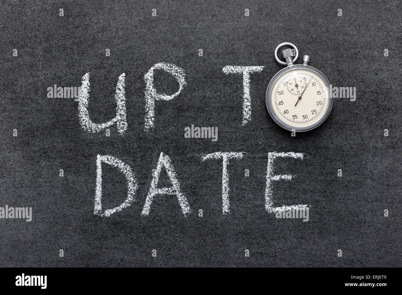 Jusqu'à ce jour sur la main concept chalkboard with vintage chronomètre précis utilisé au lieu d'O Banque D'Images