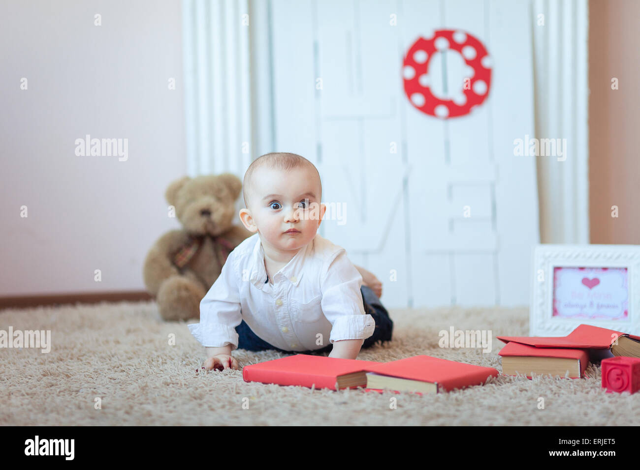 Funny baby with books Banque D'Images