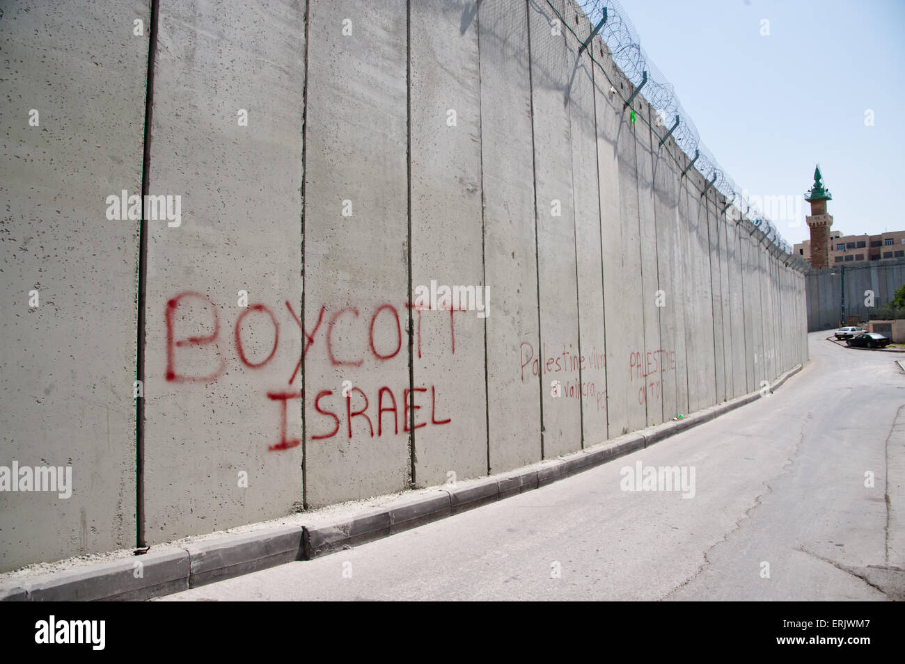 Un graffiti sur le mur de séparation israélien divisant le quartier de Jérusalem-Est d'Abu Dis lit que "boycott d'Israël." Banque D'Images