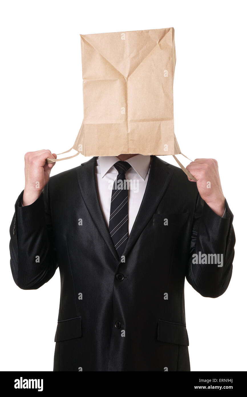 Businessman pulling sac de papier sur la tête Banque D'Images