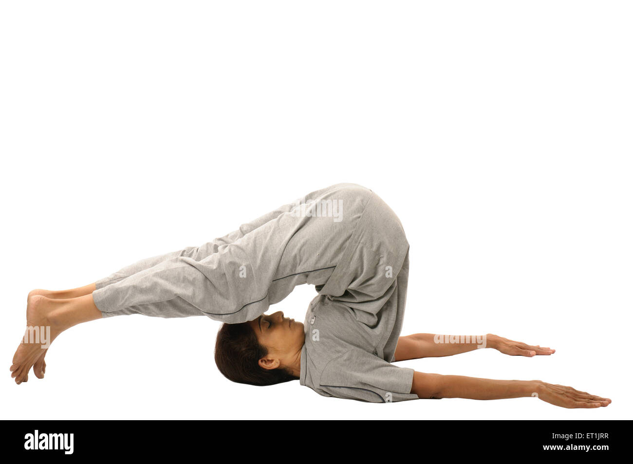 Dame faisant les exercices du Yoga halasana M.# 190 5 Septembre 2009 Banque D'Images
