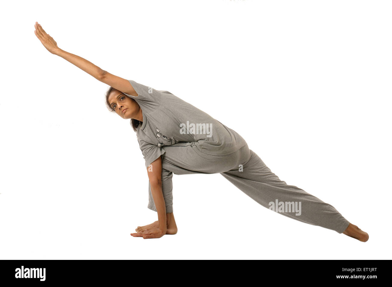 Dame faisant les exercices du Yoga parivrtta trikonasana M.# 190 5 Septembre 2009 Banque D'Images